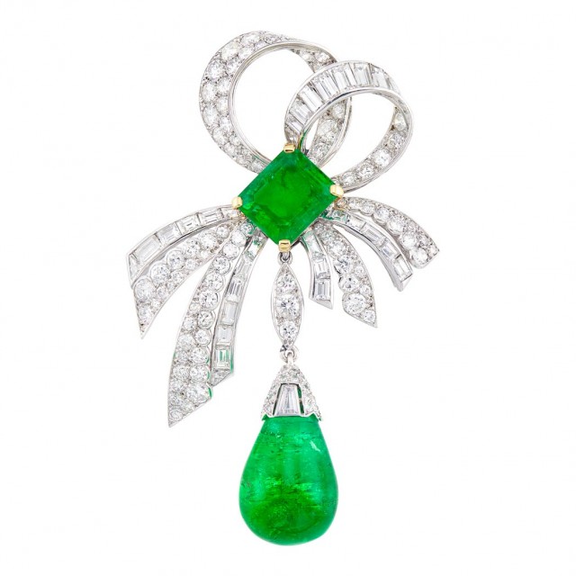 Platinum, Gold, Emerald and Diamond Bow Brooch, Monture, Cartier, France. Sold for $40,625.