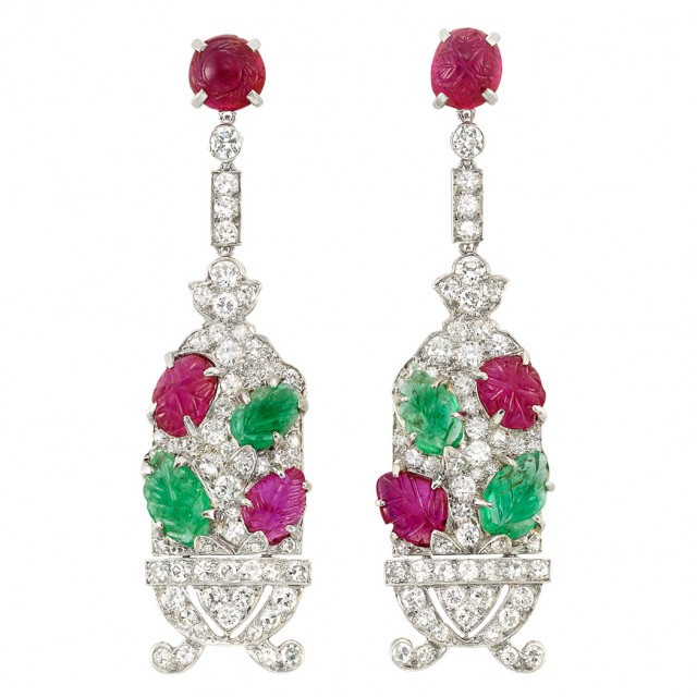 Pair of Art Deco Platinum, Diamond and Carved Emerald and Ruby 'Tutti Frutti' Pendant-Earclips, Cartier, circa 1925. Lot 424. Sold for a record $185,000.