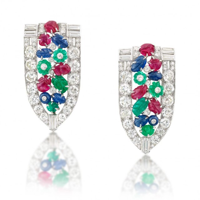 Pair of Platinum, Diamond and Carved Colored Stone 'Tutti Frutti' Clips, Ross-Pennell, circa 1930. Sold for $25,000. 