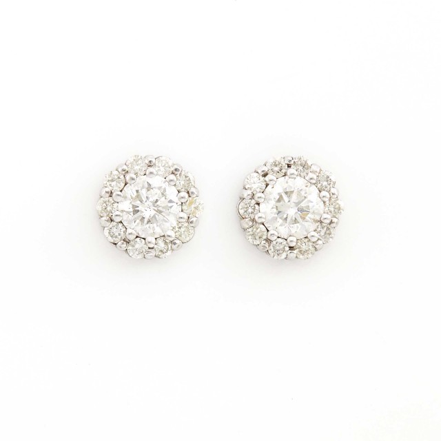  Lot 2002. Pair of Platinum and Diamond Cluster Earrings. Est. $1,000-1,500.