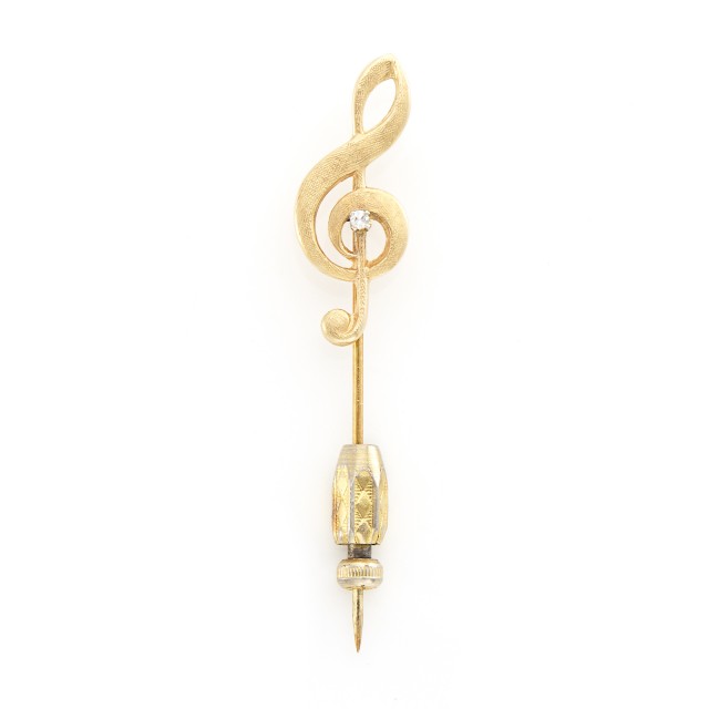 Lot 2007. Gold and Diamond Treble Clef Stick Pin. Est. $75-125.    