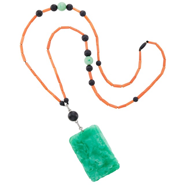 Cartier Long Coral, Jade and Fluted Black Onyx Bead, Carved Jade and Diamond Pendant-Necklace, circa 1925. Est. $20,000-30,000. The Alice Appleton Hay Collection. Lot 110. Auction June 24.