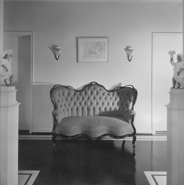 Entry hall of the Cooper’s Brentwood residence, featuring the Continental Baroque sculptures on pedestals, circa 1935. Auction April 14. Image courtesy Maria Cooper Janis