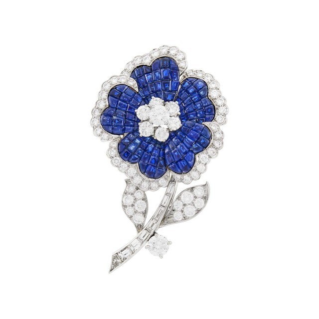 Oscar Heyman Brothers for Van Cleef and Arpels Platinum, Mystery-Set Sapphire and Diamond Flower Clip-Brooch. Lot 186. Auction Oct 21.