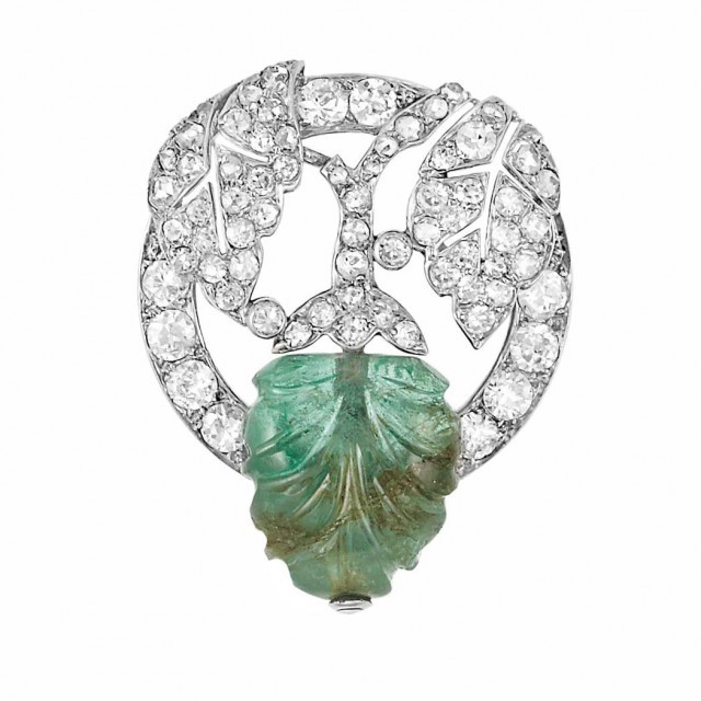Edwardian Platinum, Diamond and Carved Emerald Pin, Marchak, Paris. Sold for $2,750.