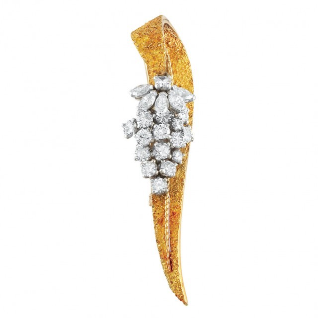 Gold, Platinum and Diamond Ribbon Clip-Brooch, Marchak. Sold for $2,500.